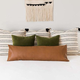 This extra long, leather lumbar pillow cover elevates that pillow that you used in college to turn your bed into a makeshift couch.